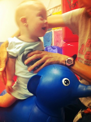 riding elephant at physical therapy down syndrome