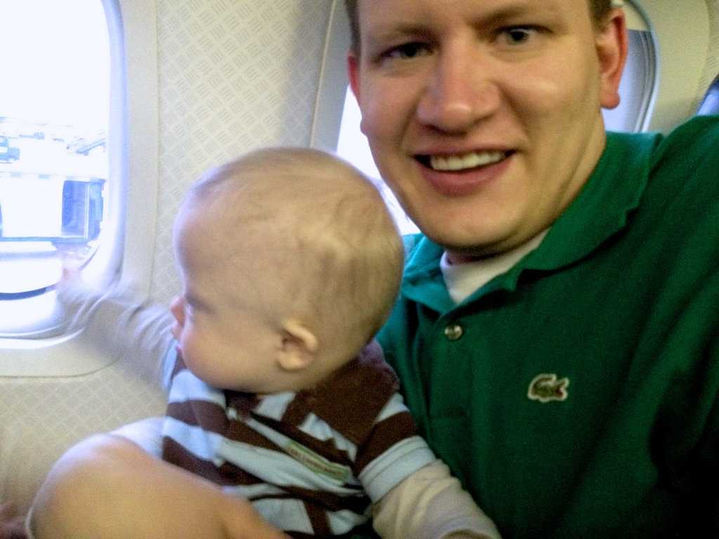 father and son with down syndrome on airplane