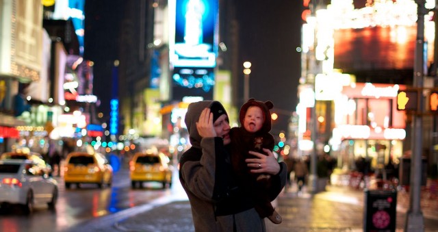 dad-holding-baby-times-square-nyc