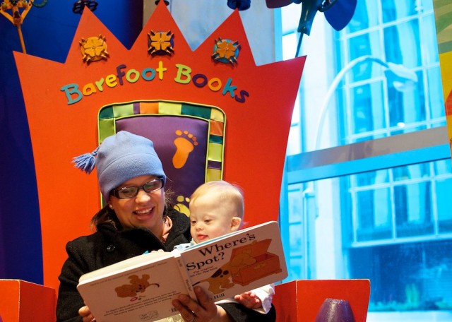 mom-reading-to-son-baby-down-syndrome-fao-schwarz