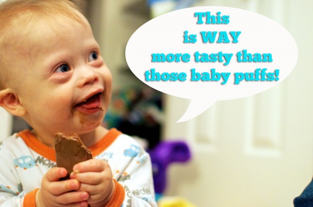 baby eating tim tam frist time chocolate candy bar 