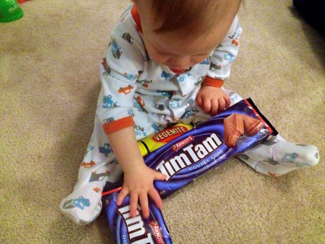 baby eating vegemite tim tam Australia