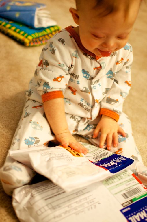 cute baby getting package from friends