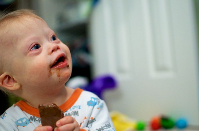 cute kid chocolate on face toddler