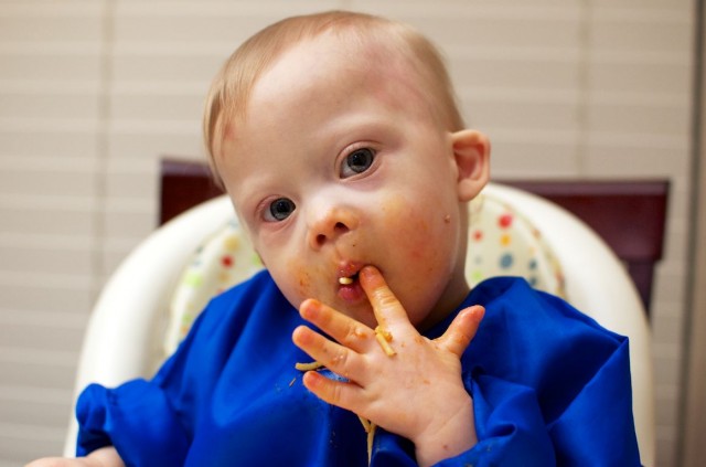 self feeding spaghetti baby child down syndrome