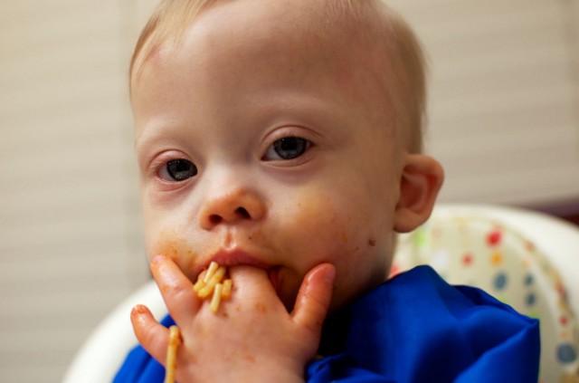 self-feeding-spaghetti-baby-child-down-syndrome 2