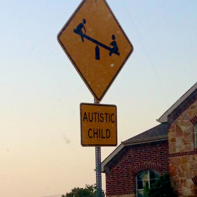 autistic child street sign special needs