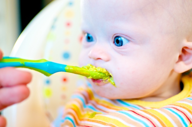 down syndrome boy pictures eating spoon avocado
