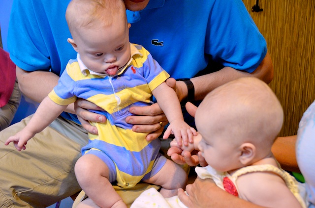 library story time down syndrome baby boy playing 2