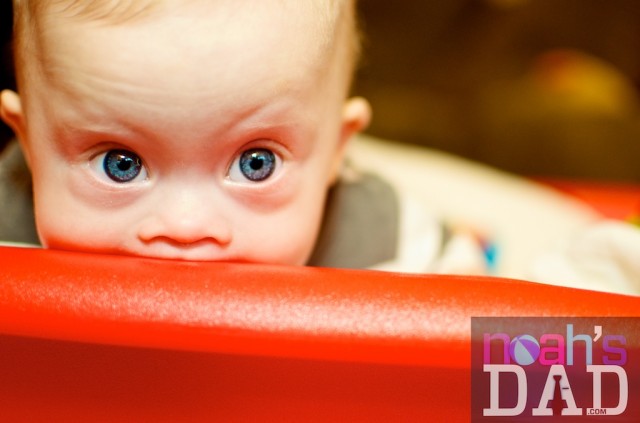 cute little boy playing in little tyke red wagon