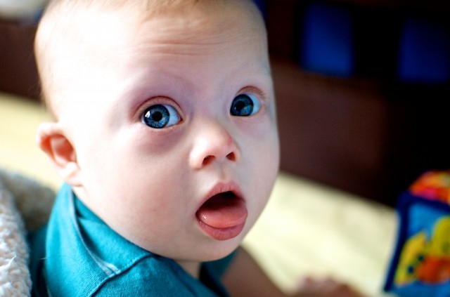 cute boy blue eyes down syndrome infant crib