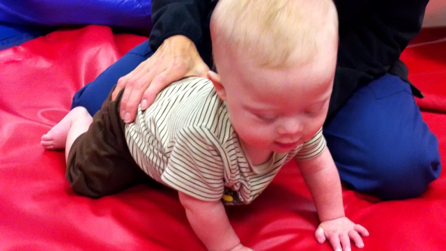 baby down syndrome learning to crawl