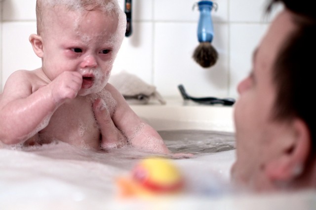 father son taking bath