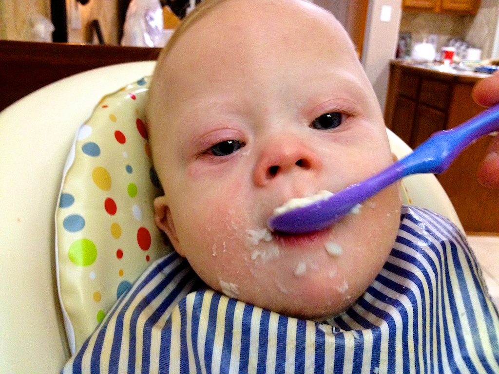 first thanksgiving baby down syndrome eating from spoon