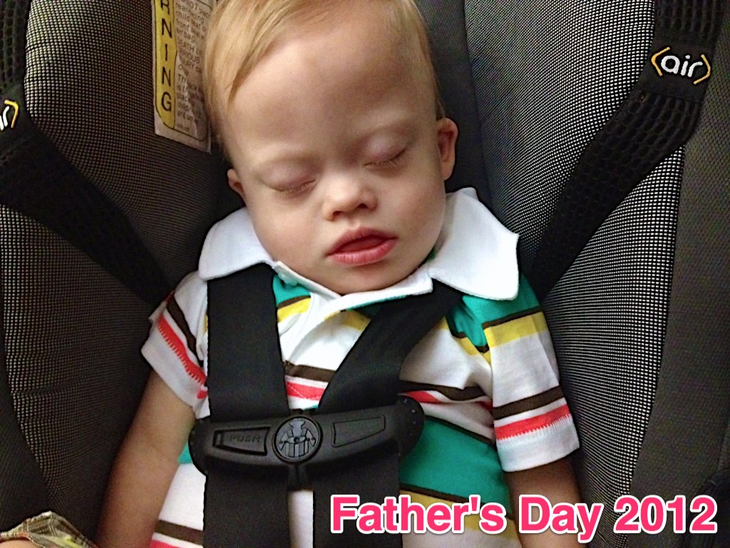 sleepy baby sleeping in car seat down syndrome