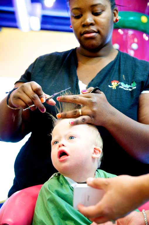 down syndrome child getting haircut special needs