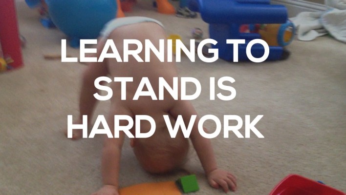 baby with down syndrome learning to stand up