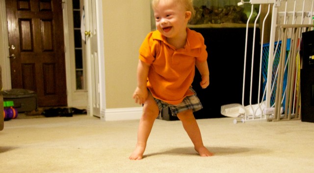 what age baby down syndrome standing up