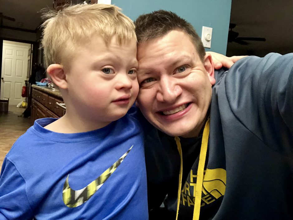 boy with down syndrome and his dad